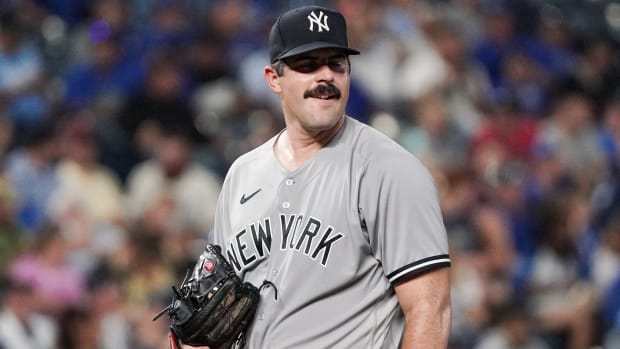 Yankees pitcher Carlos Rodón looks away after giving up a fifth run in the first inning during a game against the Royals.